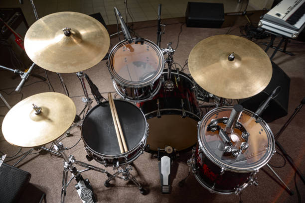 istock The drum kit is on the stage at the rehearsal base. Drumsticks is on a drum set. 1326644270