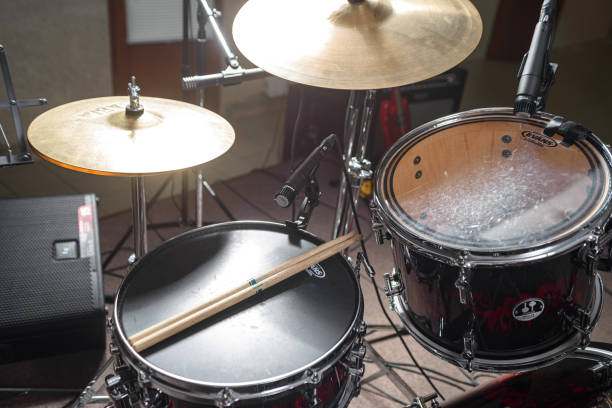 istock The drum kit is on the stage at the rehearsal base. Drumsticks is on a drum set. 1326644272