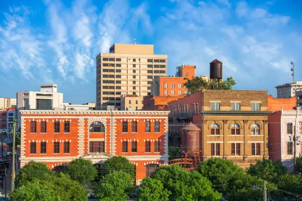 Montgomery, Alabama, USA cityscape and historic water towers.