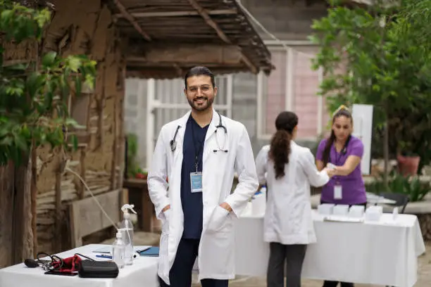 Photo of Doctor in rural area smiling at camera