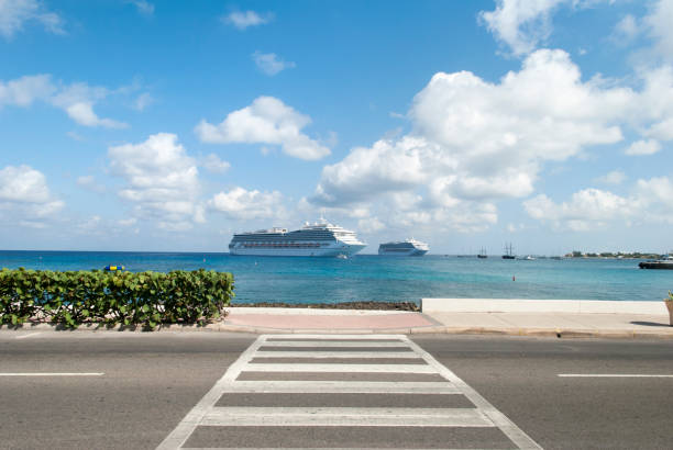The view of a crosswalk in George Town and drifting cruise ships in a background (Grand Cayman, Cayman Islands).