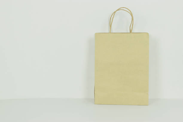 istock Brown paper bags on white 1326647076