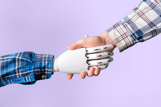 istock human and machine robot hand shake hands, concept of future technology 1326647929