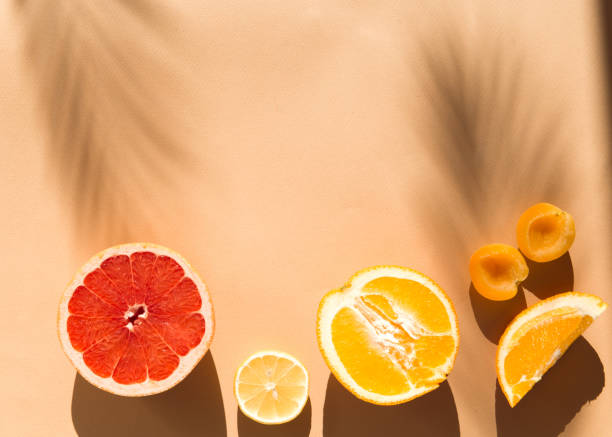 istock Flat lay with slice of orange, grapefruit and lemon on beige background 1326648172