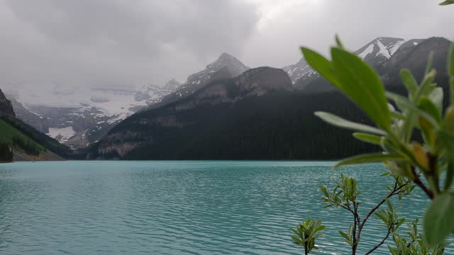 Scenic view across Lake Louise during rain storm