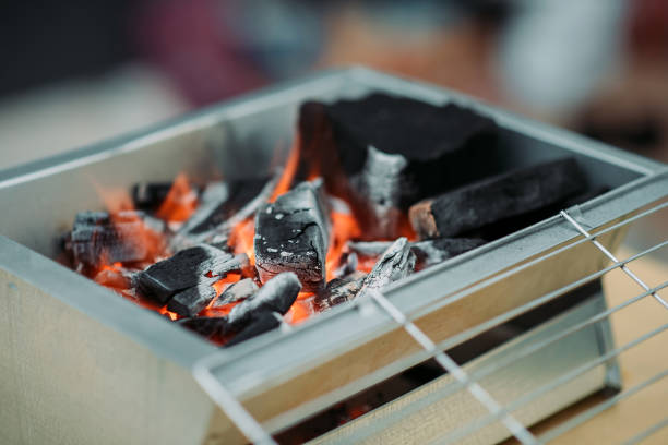istock Barbecue grill with fire preparing in front yard of house 1326651689