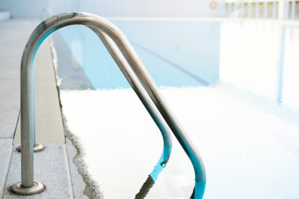 istock Indoor swimming pool with stair in a building 1326652204