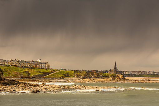 The view of Tynemouth, Cullercoats & Whitley Bay including St Mary's Lighthouse taken from Tynemouth's North Pier on a rainy day
