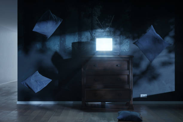 istock 3d rendering of a haunted room with an old television and bright screen. Surrounded by flying pillows 1326654911