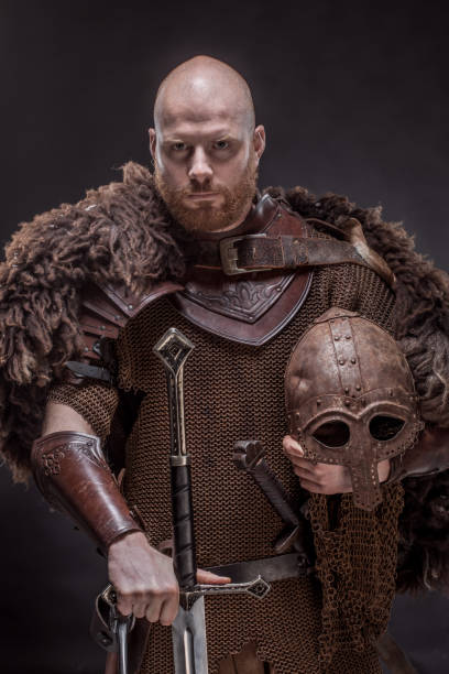 istock Weapon wielding redhead viking warrior in studio shot 1326655927