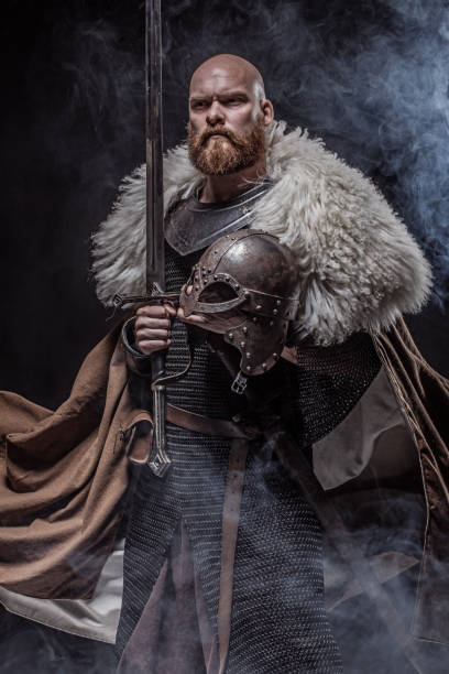 istock Weapon wielding redhead viking warrior in studio shot 1326656011