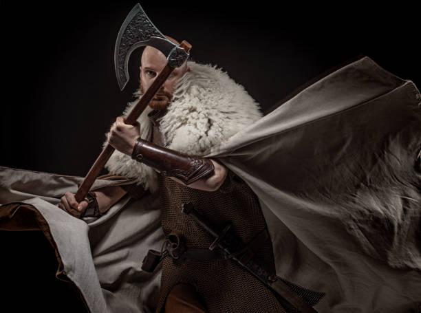 istock Weapon wielding redhead viking warrior in studio shot 1326656045