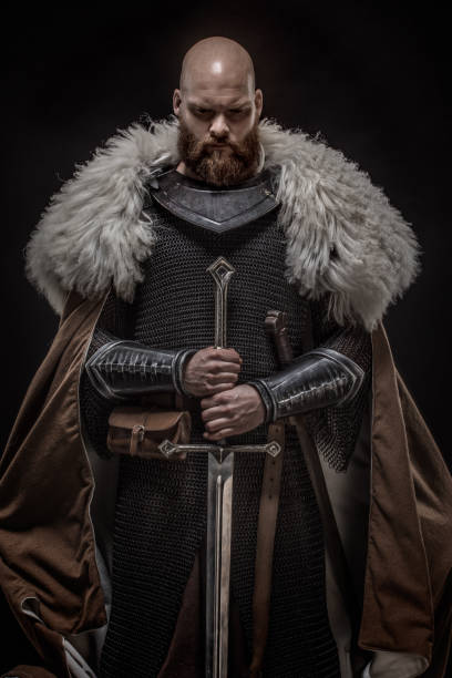 istock Weapon wielding redhead viking warrior in studio shot 1326659189