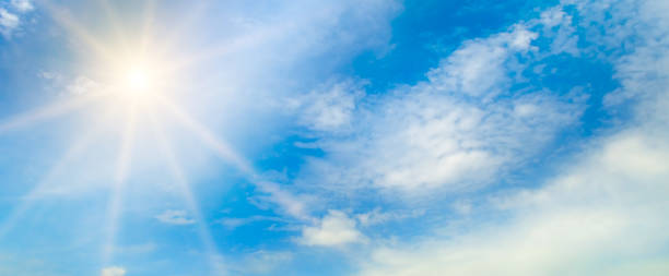 istock blue sky , sun and beautiful natural white clouds. Wide photo. 1326663521