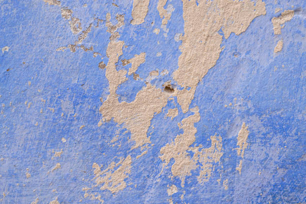 istock Texture of an old plastered wall, whitewashed in blue. Close-up, wallpaper, background. 1326663650