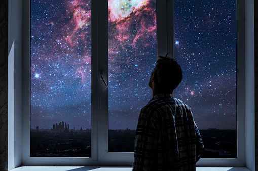 person standing next to the window and watching outside, admire the star on night sky, elements of this image furnished by nasa