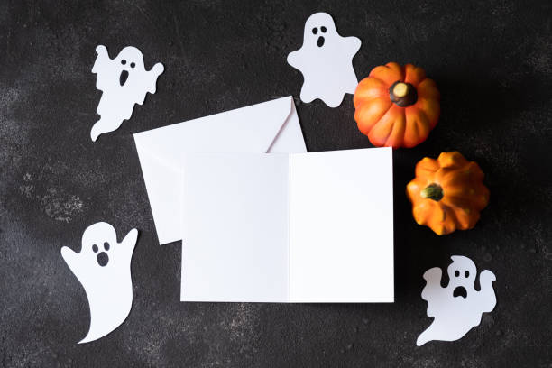istock Blank paper card with cute ghosts on dark background. Template for Halloween 1326669856