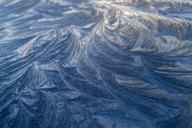 istock Beautiful frosty pattern an equal surface in winter morning. 1326670857
