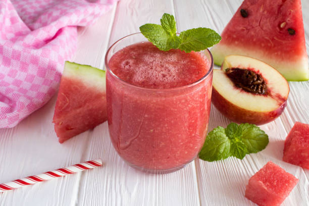 istock Smoothie from watermelon and nectarine on the white wooden background 1326675255