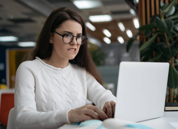 istock Student studying online, exam preparation. Busy woman using laptop computer, working project in modern office. Portrait of creative copywriter typing on keyboard, sitting at workplace 1326677190