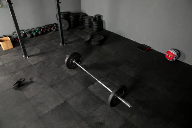 istock Olympic bar with weight plates in gym 1326681084