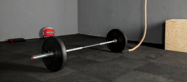 istock Olympic bar with weight plates in gym 1326681788