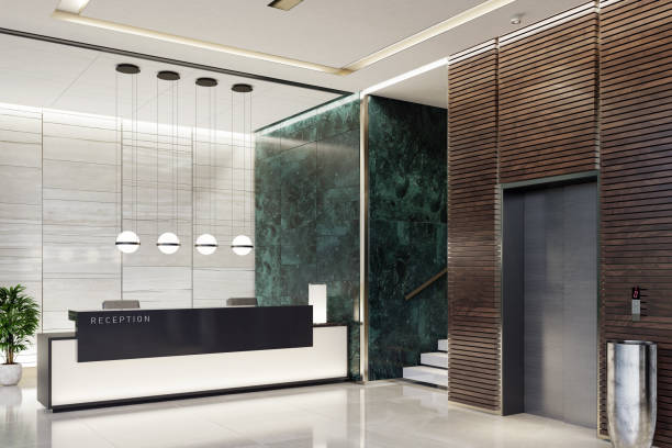 Modern Offices lobby interior area with elevators and stairs and with long reception desk Modern and luxurious Offices lobby interior area with elevators and stairs. Long reception desk.
green marble wall tiles decoration. 3d rendering gold desk lamp stock pictures, royalty-free photos & images