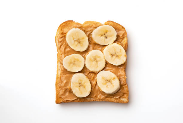 ピーナッツバターサンドイッチ、バナナ - butter toast bread breakfast ストックフォトと画像