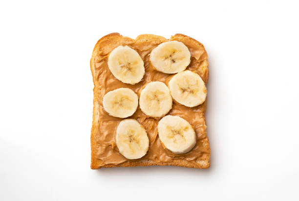 Peanut butter sandwiches with banana Peanut butter sandwiches with banana Nut Butter and Banana Slices on Whole Grain Bread stock pictures, royalty-free photos & images