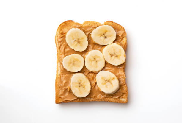 Peanut butter sandwiches with banana Peanut butter sandwiches with banana whole wheat stock pictures, royalty-free photos & images