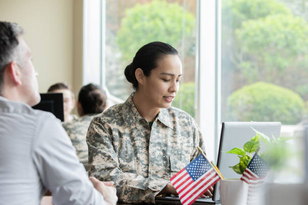 istock Female military recruiter listening while discussing options with another soldier 1326707778