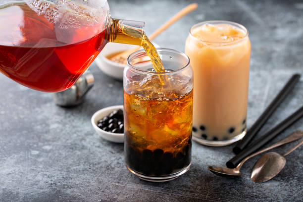 Making milk bubble tea Making milk bubble tea with tapioca pearls bubble tea photos stock pictures, royalty-free photos & images