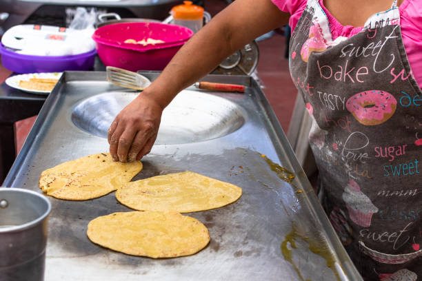 istock woman's hand preparing a typical mexican food as a quesadillas 1326713993
