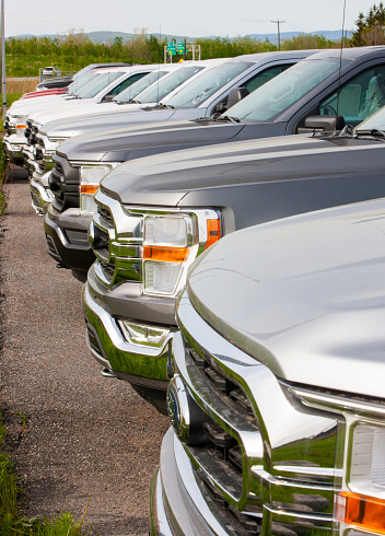 Saint Foy, Quebec, Canada - May 18, 2021:2021 Ford F-150 pickup trucks in parking lot of Ford Dealership.