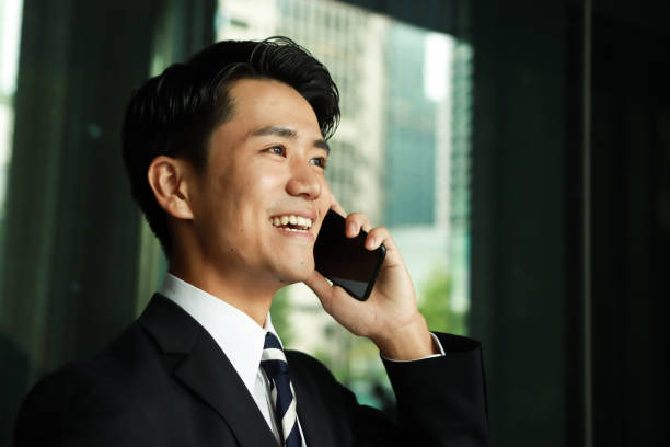 Smiling Young Businessman on the Phone stock photo