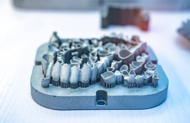 istock Tooth dental crowns created on 3d printer for metal 1326727467