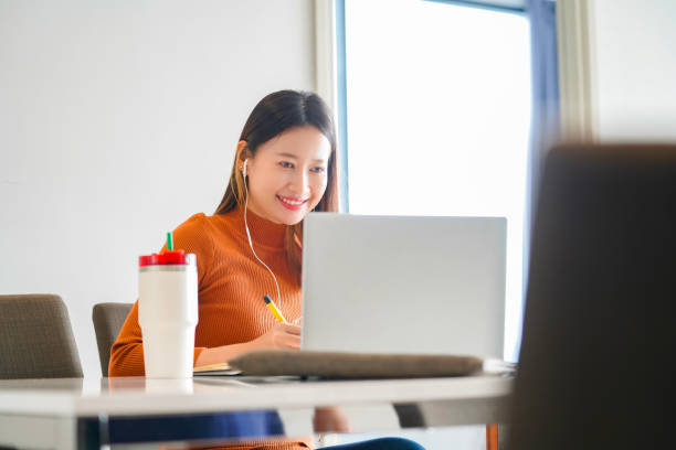 istock Asian woman online working or studying on laptop computer at home 1326731682