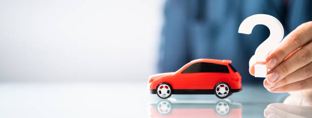 istock Person Hand Holding Question Mark Next To Car 1326733498