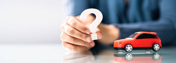 istock Person Hand Holding Question Mark Next To Car 1326733501