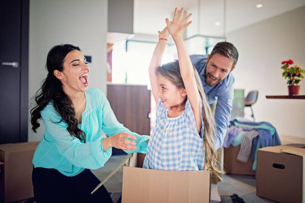 istock Happy family moving into new home 1326733843