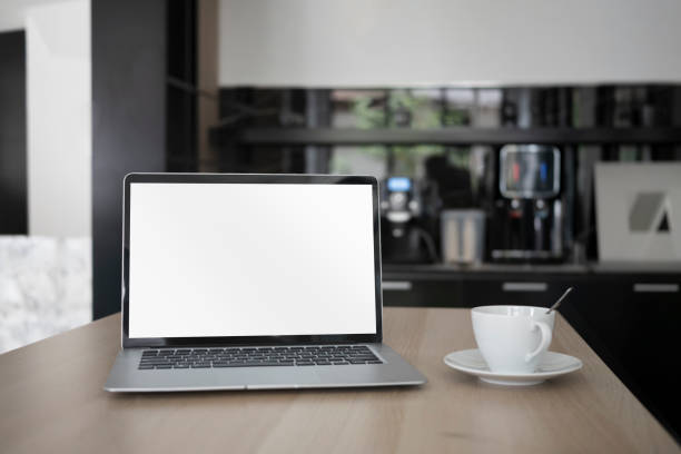 istock Laptop computer with empty display and coffee cup on wooden desk. 1326734453