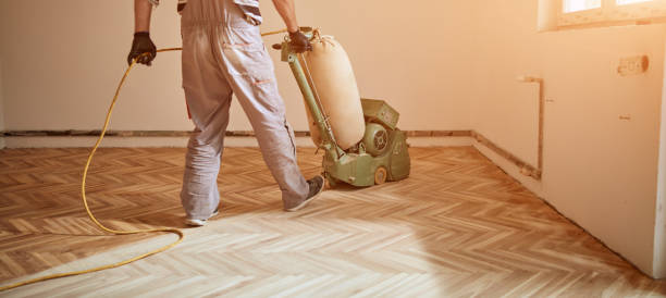 istock Repairman restoring parquet with a sanding machine. 1326738509