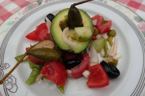 istock Avocado served with seasoned raw vegetables and caprons  Vegetarian appetizer 1326740504