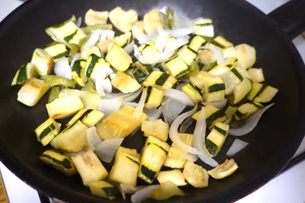istock Sliced vegetables fried to make an omelette Courgette onion green pepper spices 1326740770