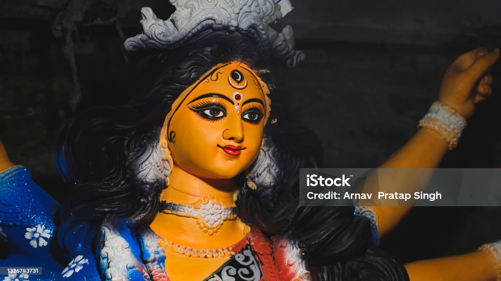Beautiful portrait of Hindu Goddess Durga Goddess Durga idol during Durga Puja festival. Durga worship is a yearly event and these deities are created every year and immersed in a river every year after the completion of the 5-day event. Celebrated in India. The idol is not copyright protected. Durga Stock Photo