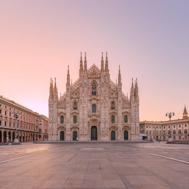 The Duomo at sunrise Have you ever seen the Duomo square of Milan completely empty? Well here is a photo for you! cathedrals stock pictures, royalty-free photos & images