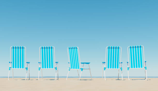 istock chairs on sandy beach near sea 1326753750