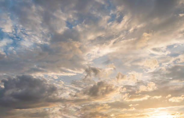 istock Morning blue orange sky, sun shining through clouds 1326755188