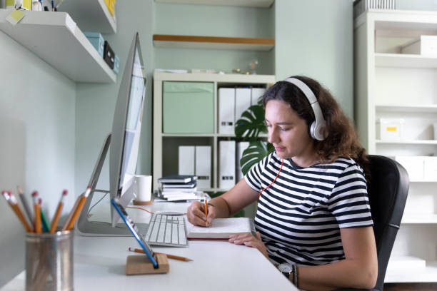 istock Young woman working from home 1326757684