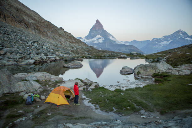 istock Man camping on mountain top, sunrise 1326757788